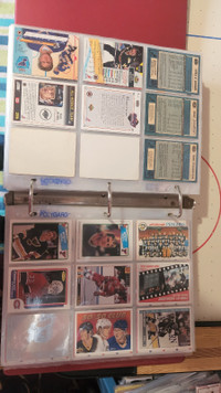 Binder of approximately 95 sheets of a 1000 of sports cards