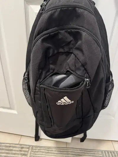 -gently used - has many compartments to store binders, laptop, gym clothes, etc…