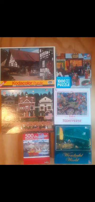 Selling puzzles for $10 each. 3 1000 pieces, one 750 piece, one 550 piece and one 500 piece that is...