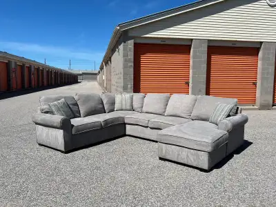 Grey Leon’s U Shaped Pullout Bed Sectional , View more