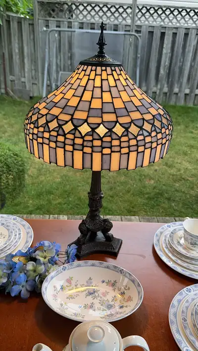 Beautiful Tiffany style table lamp. Has a stained glass shade , View more