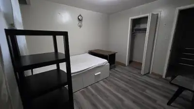 FOR RENT. Shared two-bedroom basement (plus upper floor) apartment (with one other tenant currently...