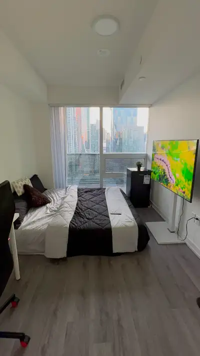 Wake up to a stunning downtown Toronto skyline every day in this bright, modern private bedroom loca...