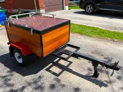 Homemade cargo trailer for use with motorcycle or a small vehicle. Always stored indoors. New wheels...
