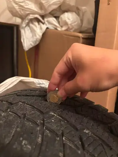 3 winter tires on rim in good condition plus one bare rim. About 1/4 inch tread depth.