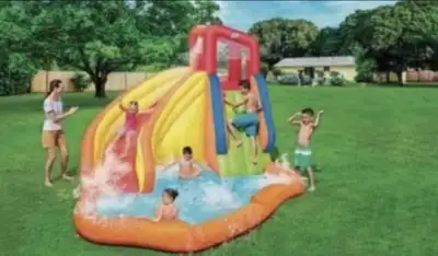 Make a splash this summer with this used inflatable water slide, perfect for hours of backyard fun!...