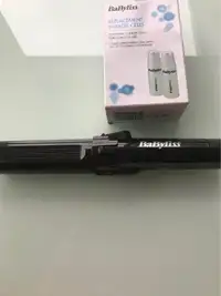 Cordless curling iron and 2 energy replacement cells