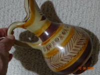 8 inch jug,  signed,  not sure origin ,pottery ,designed,for oil