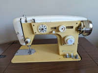Kenmore Sewing Machine (in table) with included sewing kit