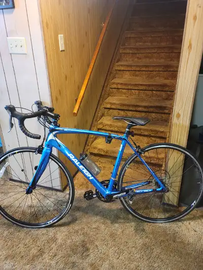 This Raleigh road bike has only been ridden a couple of times and is in brand new condition. It is b...