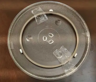 This brand new Panasonic Microwave Turntable Glass Plate with ring wheels, measuring 12.4 inches. It...