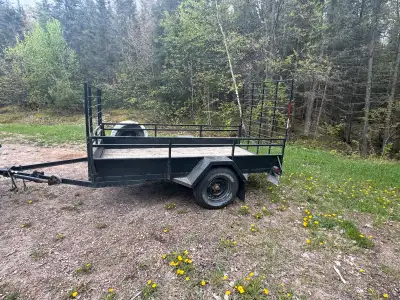 5x10 trailer with ramp. Front also has gate that can be hinged forward for more room or dropped down...