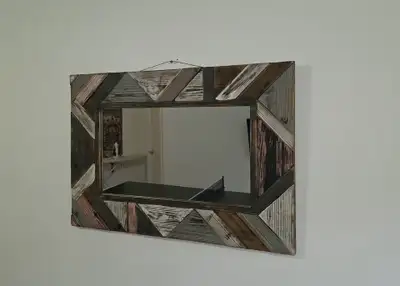 This beautiful rustic wall mirror features a unique, handcrafted frame made from reclaimed wood arra...