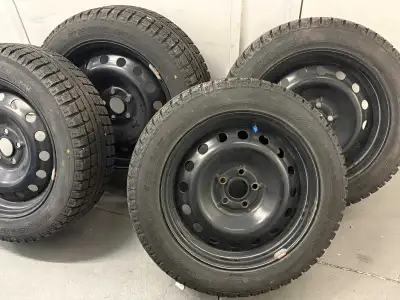 These are MaxTrek M7 winter tires, size 205/55R16 91H, mounted on black steel rims. These tires are...