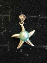 Real baby blue Akoya pearl set in a sterling silver starfish
