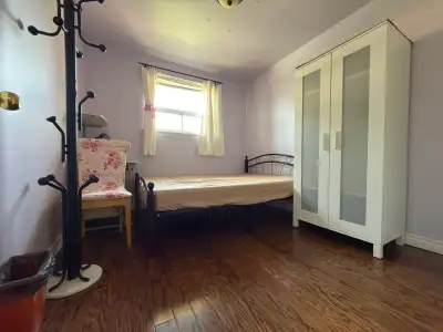 This cozy and well-maintained private room features a convenient ensuite half-bathroom with a vanity...