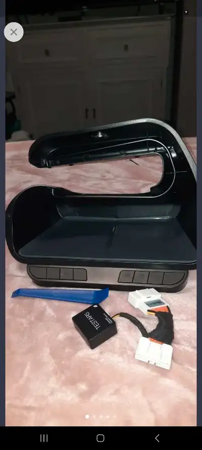 . It is an organizer that fits in the center console of a Tesla Model 3 or Y. It comes with 8 physic...