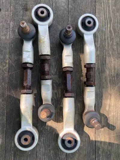 Audi adjustable front upper control arms +/- 1.5 degrees on both Camber and Caster Two boots would b...