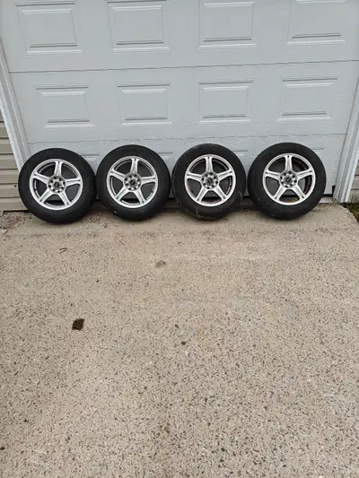 15x6.5 aluminum wheels. Hole spacing 4x100 or 5x100. Tires on wheels are cracked and worn out. $80
