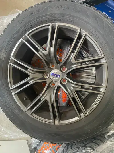 Complete set of 4 premium Nokian Hakkapeliitta R3 SUV studless winter tires, mounted on dark grey 18...