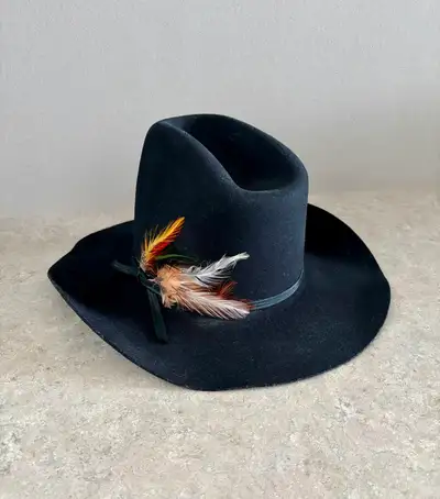 Saddle up and add some western flair to your wardrobe with this black felt Lanning cowboy hat! This...