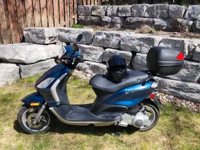 Selling mint condition almost new piaggio fly 150CC, comes with new helmet and top box. If the ad is...