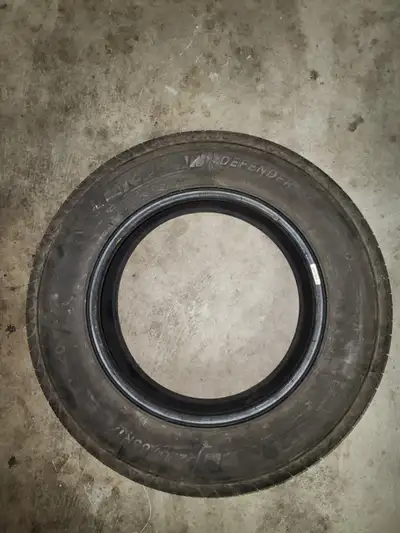 Selling one Michelin Defender tire (225/65R17) in good used condition. Tread remaining: ~60–70% Cond...
