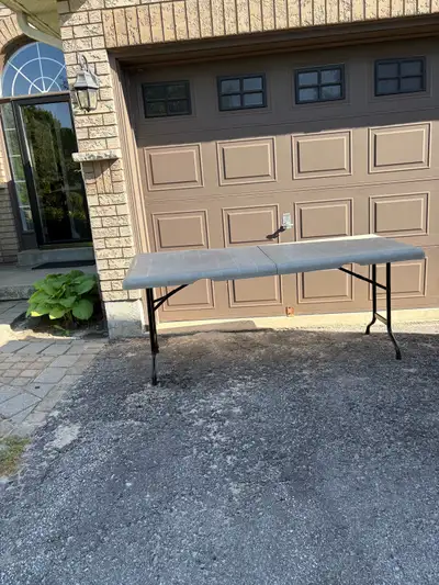 Indoor/Outdoor folding plastic table with metal legs. Dimensions 72 “ long by 30” wide and 30” high.