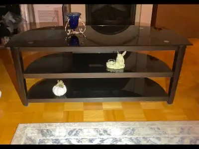 Black sleek looking credenza, for TV or game stations. 2 shelves to display knick knacks, or your ga...