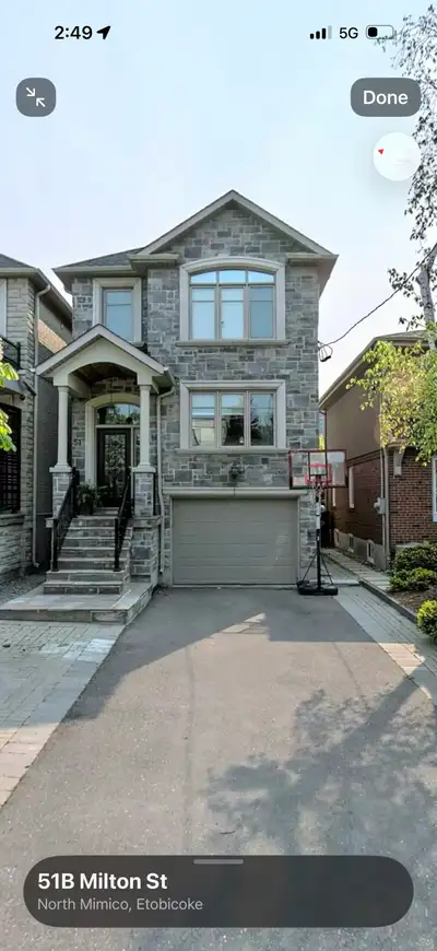Modern high end one bedroom high ceiling walkout basement apartment with a living room, kitchen and...