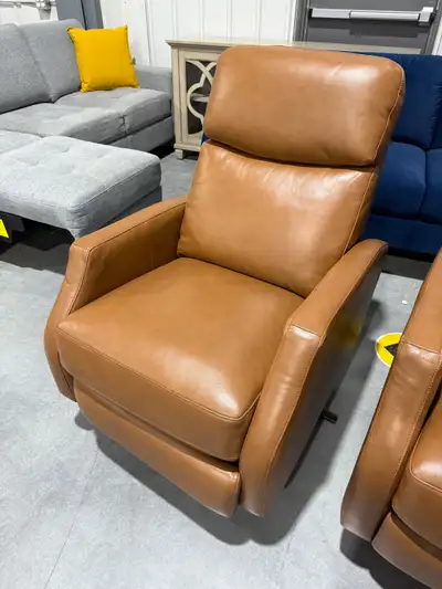 Tan leather swivel pushback recliner, View more