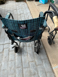Two wheelchairs with leg supports