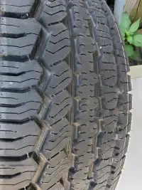 ONE TIRE TREAD IS NEW. WAS A SPARE P265/70/R16