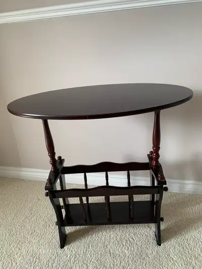 Cherrywood oval magazine table. Like new for pickup only, View more