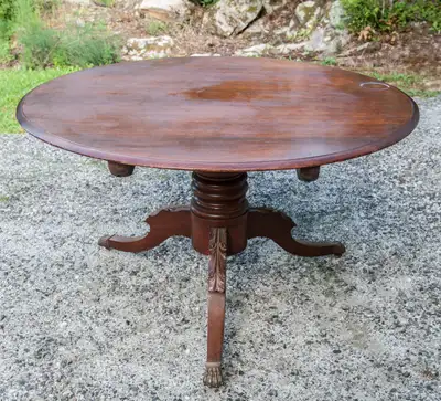 FOLDING ROUND KITCHEN TABLE. 48 INCH DIAMETER, 29 INCHES HIGH. METAL CLAW FEET WITH WHEELS. STURDY U...