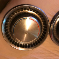 2 Vintage Chevy 300 hub caps.$95