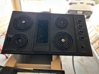 Electric cooktop with down vent