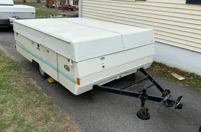 Used Coleman, 8' box, Pop-Up Tent Trailer. Fibreglass top, canvas removed. Similar to photo but dirt...