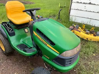 LA 140 -48inch ~ LX 188 -48 inch with bagger attach ment Please call 306-749-2649 Can not newer emai...