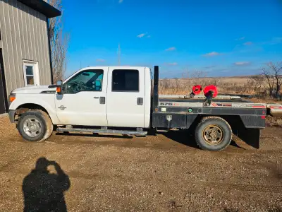 2011 Ford F350 XLT Super Duty with 676 DewEze bale deck