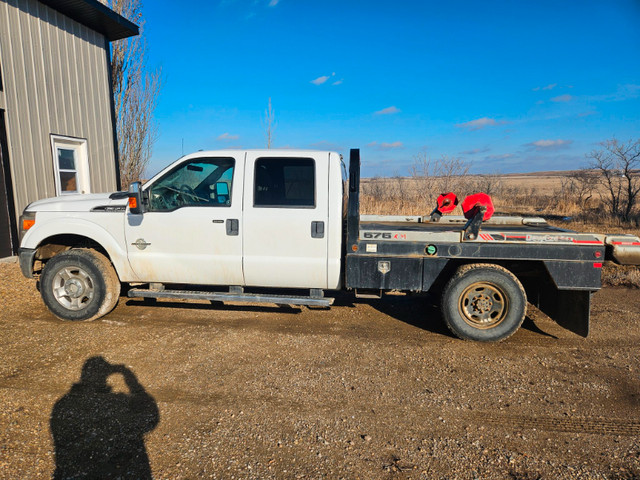 2011 Ford F350 XLT Super Duty with 676 DewEze bale deck in Cars & Trucks in Swift Current