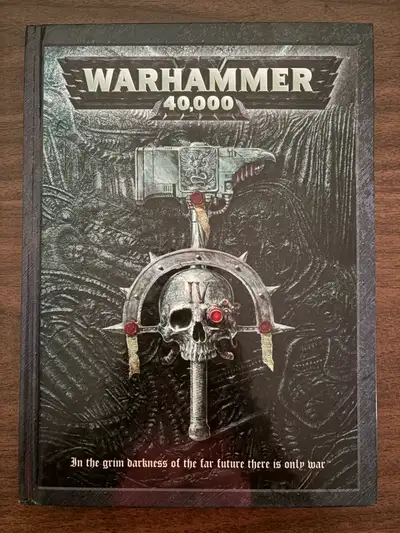 Dive into the grim darkness of the far future with this Warhammer 40,000 rulebook, providing all the...