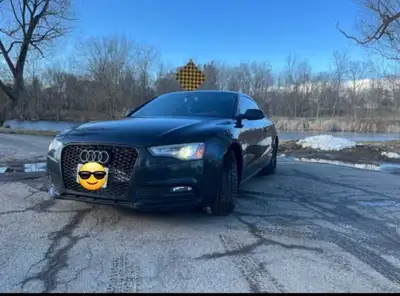 Experience luxury and performance with this 2013 Audi A5. This car combines sporty handling with Aud...