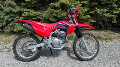 2023 Honda CRF250F Less than 1 hour on it, no drops, no scratches. The tires still have the nibs on...