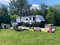 RV Travel Trailer on Lake Lot
