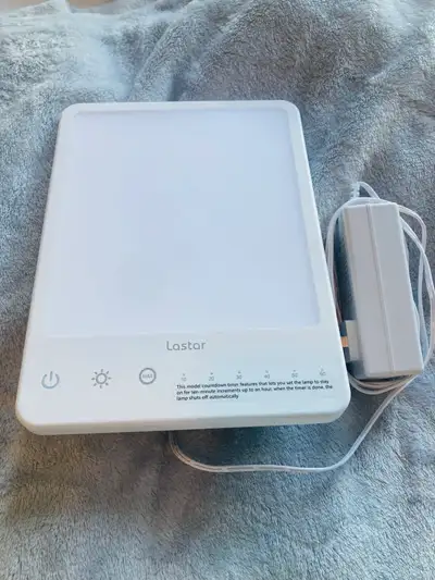 This is a Lastar sunlight lamp, designed to help combat seasonal affective disorder with its adjusta...