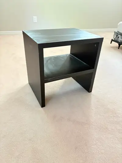 Black IKEA nightstand/end table with lower shelf. Good for a bedroom, basement, dorm, or spare room....