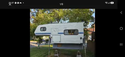 1980/90 8ft camper It features a cozy interior with a kitchenette, sleeping area, and some original...