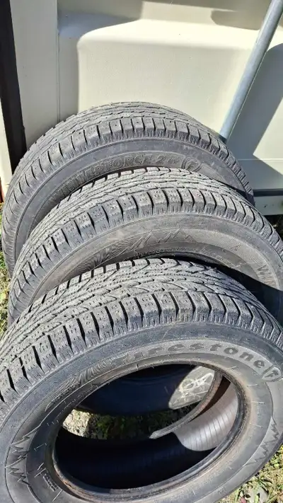Get ready for the snowy roads with these used Firestone Winterforce 2 tires in size 225/70R16 103S....