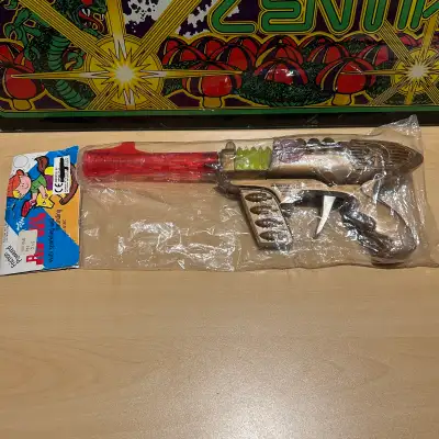 Awesome toy ray gun with sparking and sound still in it’s original packaging. Great 70s space toy wi...
